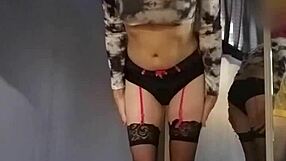 trying on a new outfit with a crop top and red mini skirt