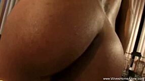 Watch this ebony housewife furiously masturbate with a dildo in her solo moment.