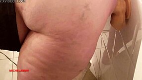 suggestive teen masturbates with big dildo in bathroom.