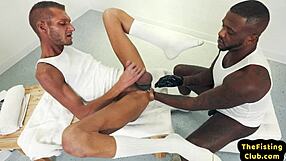 skinny gay bottom endures assfisting and foot fisting from black hunk in gloves