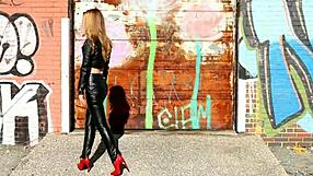 Look at this blonde posing in black leather pants, jacket, and high heels, the mistress teases.