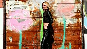 Look at this blonde posing in black leather pants, jacket, and high heels, the mistress teases.