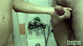 brunette girlfriend passionately sucks in the steamy bathroom, her emotions swirling with desire