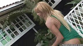 Foxy blonde shemale babe tugs her cock outdoors solo.