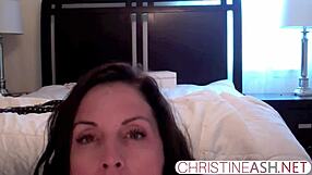 Christineash performs bound strap-on masturbation in motel webcam session.