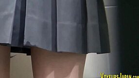 Japanese teen in uniform fingers her wet pussy suggestively