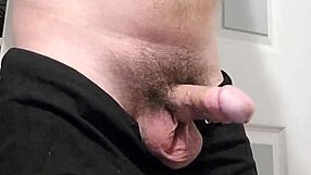 Throbbing Hard Cock Leaks Precum in Intense Close-Up