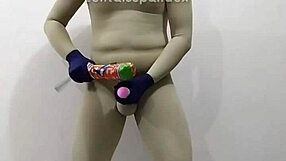 In the dungeon, zentai femdom inflicts painful CBT on slave's penis