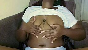 Black babe's teasing pussy play with big tits.
