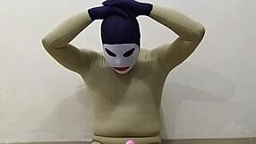 In the dungeon, zentai femdom inflicts painful CBT on slave's penis