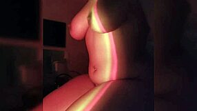 Latina amateur rips clothes during teasing striptease in dark room