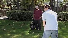 they play golf on the ass of a girl, using clubs and balls in a fun outdoor game on the field