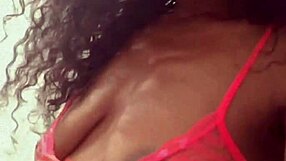 Ebony woman dances sensually in a sexy black outfit