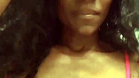 Ebony woman dances sensually in a sexy black outfit