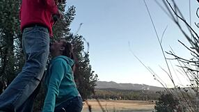 Behind the scenes, a slut gives an outdoor blowjob in public