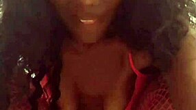 Ebony woman dances sensually in a sexy black outfit