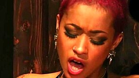 Watch this inked ebony femdom get her pussy licked by a bound lesbian sub!