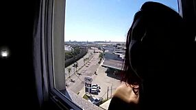 Naked woman exposes big tits at hotel window near airport