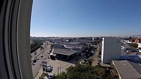 Naked woman exposes big tits at hotel window near airport