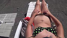 juicy booty teases in public beach booth