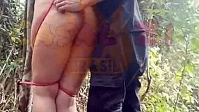 Submissive girlfriend sucks and fucks hard on a nature trail with rough bondage