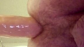 gay guy struggles to fit large dildo deep in his ass