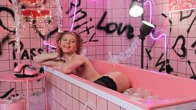 anita chilling in a pink trash bath