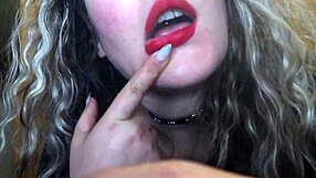 Cute red lips girl smokes and flaunts her huge b**bs