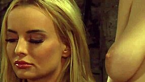 Busty tied up lesbian slave whipped by dominant madame