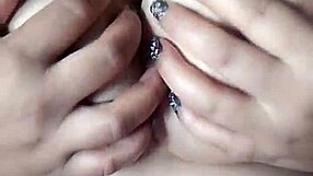 pornstar poosoo massaging her big boobs in a teasing way