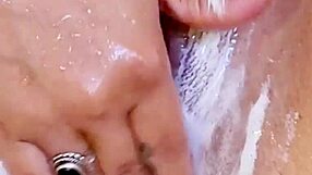 i plays with my shaved wet pussys in the showers with ass plugs