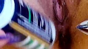 i plays with my shaved wet pussys in the showers with ass plugs