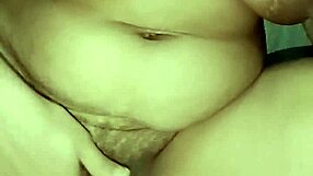 Sexy babe fingering herself nude in the toilet.