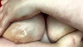 Hey, check out this sexy BBW massaging her big natural tits with oil in homemade lingerie.