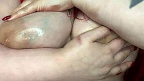 Hey, check out this sexy BBW massaging her big natural tits with oil in homemade lingerie.