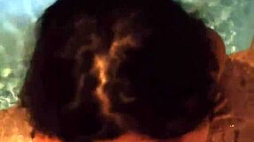 Blowjob in the pool with intense sucking action.