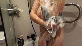In the shower, the teen invites oral pleasure and gets drilled passionately. Her shaved pussy glistens under the water.