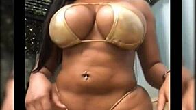 hot babe flaunts huge tits in bikini pool