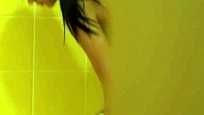 brunette with tattoos enjoys a relaxing shower