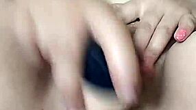 Pornstar Poosoo Intensely Uses New Dildo Under Falling Water