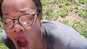 Ebony slave holds pee outdoors as master pisses on her during desperation play.