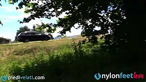 Brunette exposes nylon feet and ass on busy street