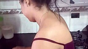 Wife cleans house while chatting