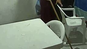 Wife cleans house while chatting