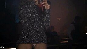 Kim shows off her pussy in a thong at the df club, teasing with every move