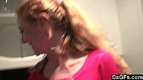 these amateur lesbians are kissing and touching small tits in the kitchen