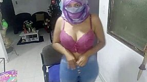 Adult woman in hijab and niqab panties and stockings performs her foreplay on the webcam