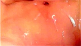 Brunette tranny shoots cum all over her belly