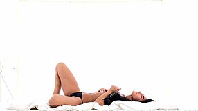 Sultry Czech pornstar Lexi Dona feels pleasure fingering her sweet puffy pussy passionately.