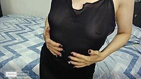 A woman in a dress reveals her small white breasts